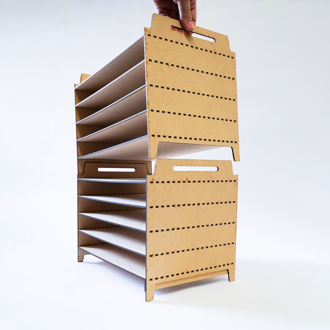 An additional drying rack being lowered onto a matching unit