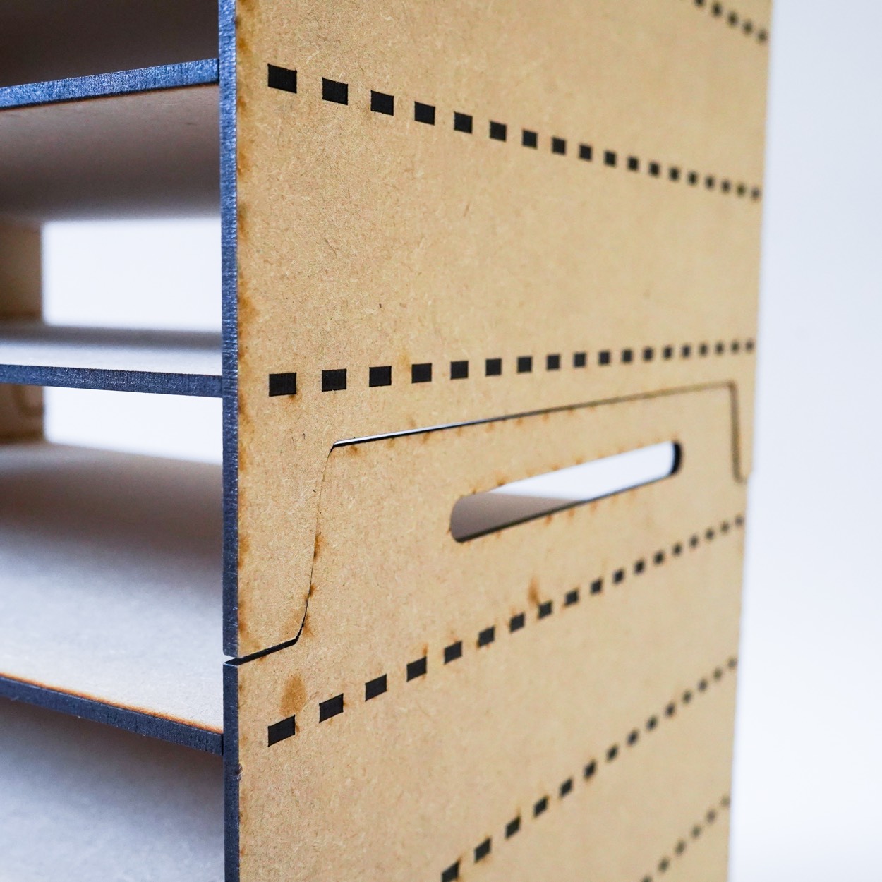 Close-up of the interlocking joint between two stacked print drying racks