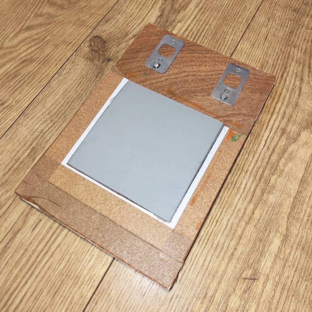 Lino block placed in frame to test before printing