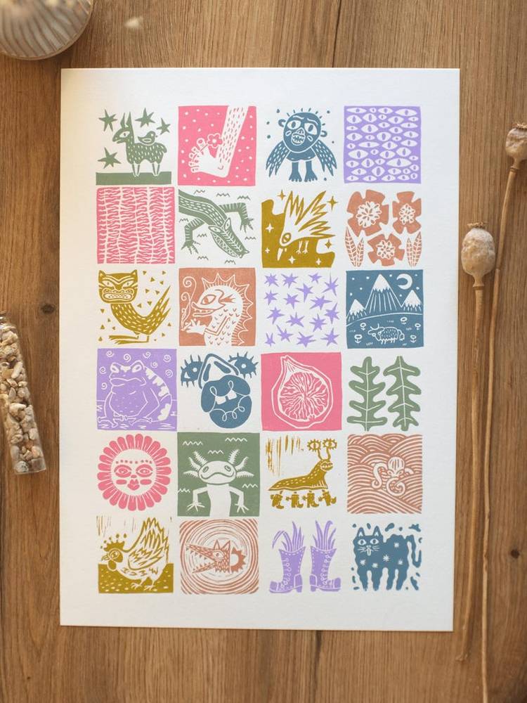 Sasha Boio Art’s Microverse linocut print, a colourful grid of 24 squares filled with quirky creatures, plants, stars and patterns.